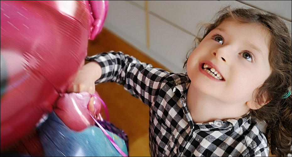 Child and balloons